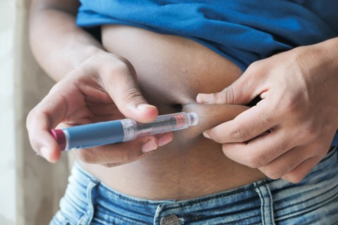 Yong Person Injecting Insulin
