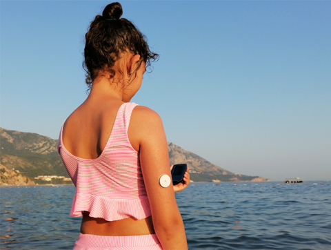 Girl With CGM On Arm Sea R