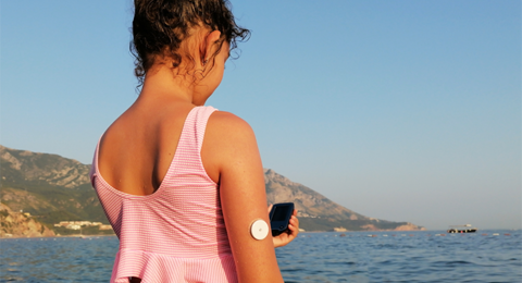 Girl With CGM On Arm Sea R
