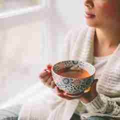 Woman Having A Cup Of Tea Indoor