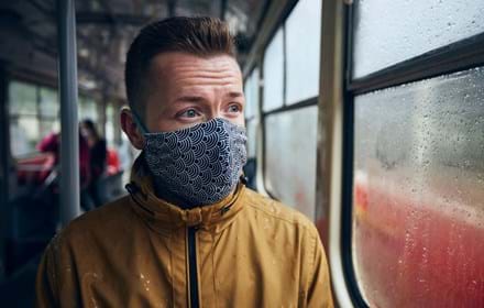 Man Wearing Face Mask On Public Transport