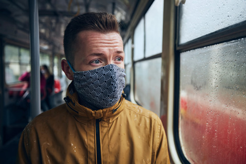 Man Wearing Face Mask On Public Transport