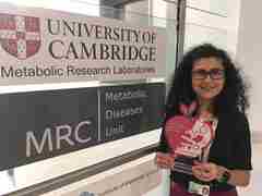 Dr Rajna Golubic, at the University of Cambridge holding her DRWF funding plaque 